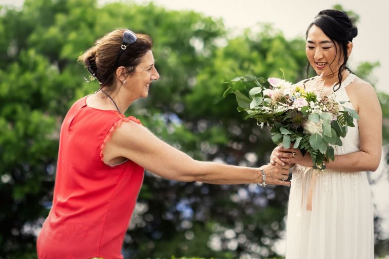 When is the right moment to give the bouquet to the bride?